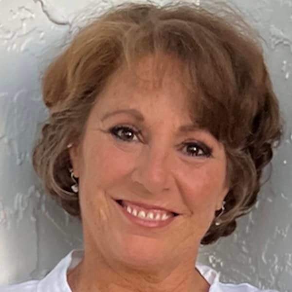 Inspirational speaker Lori Spagna at New Living Expo focusing on holistic and personal growth.