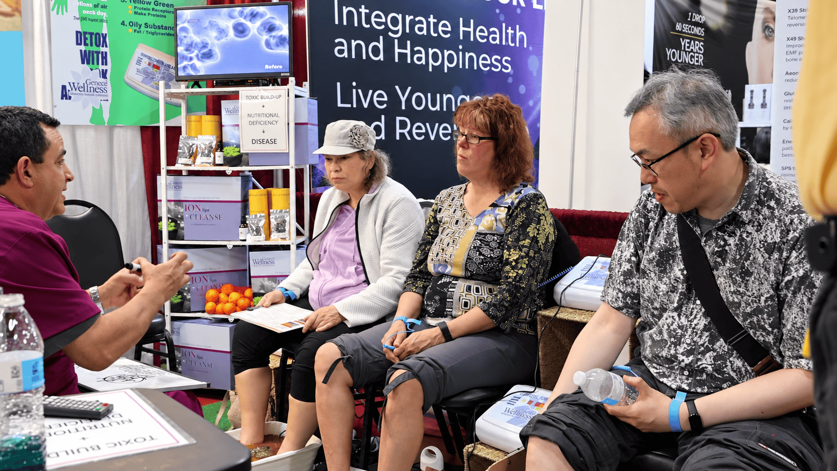 A small-group conversation at a past New Living Expo