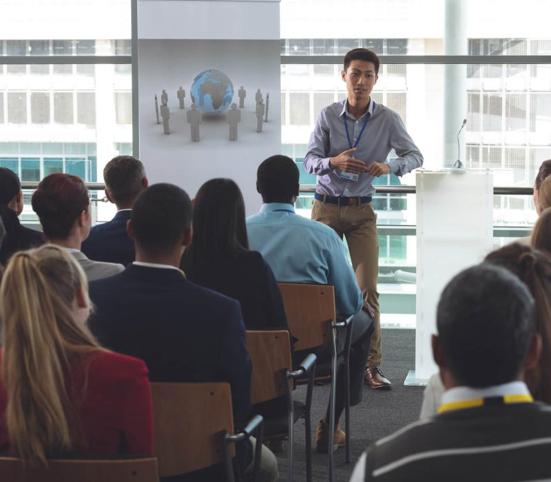 young-businessman-speaking-in-front-of-business-pr-2023-11-27-05-30-30-utc.jpg